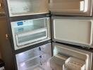 Open refrigerator with multiple compartments