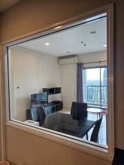 Modern living room with dining area and balcony view