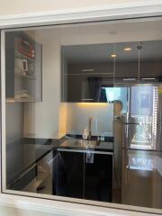 Modern kitchen view through glass partition