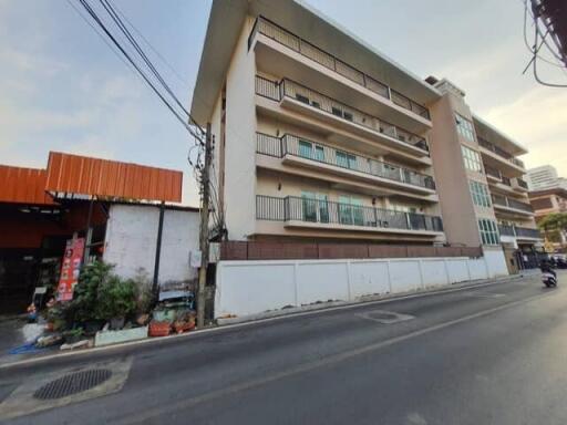 Exterior view of a multi-story residential building with balconies