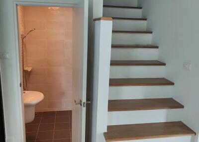 Hallway with stairs and bathroom