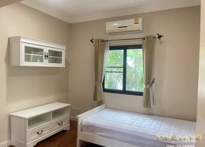 Bright bedroom with air conditioning and single bed