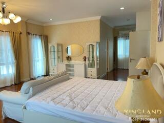 Spacious bedroom with a large bed and elegant decor