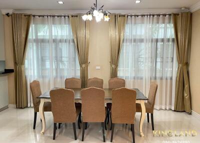 Spacious dining room with elegant furniture and natural lighting