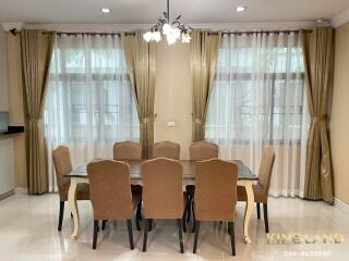 Spacious dining room with elegant furniture and natural lighting