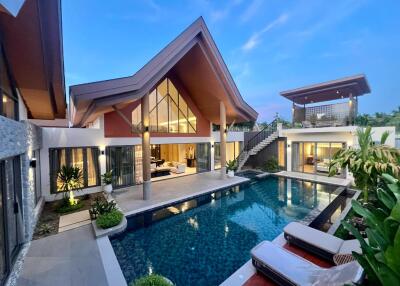 Modern luxury villa with pool and outdoor seating area