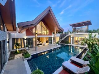 Modern luxury villa with pool and outdoor seating area