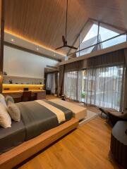 Modern master bedroom with large window and wooden floor