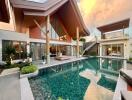 Modern house exterior with large swimming pool and outdoor seating area