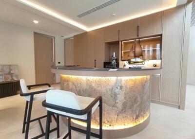 Modern kitchen with illuminated island and wooden cabinets