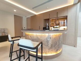 Modern kitchen with illuminated island and wooden cabinets