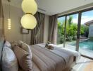 well-lit bedroom with poolside view