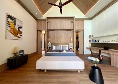 Spacious modern bedroom with a high ceiling and stylish decor