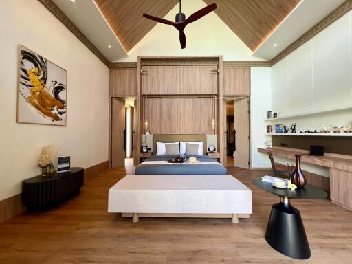 Spacious modern bedroom with a high ceiling and stylish decor