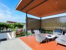 Modern outdoor seating area with lounge chairs and a covered pergola