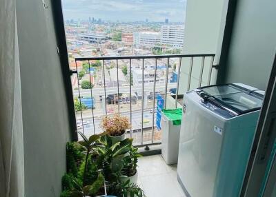 Balcony with city view and washing machine