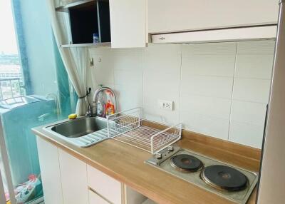 Modern kitchen with appliances and balcony view