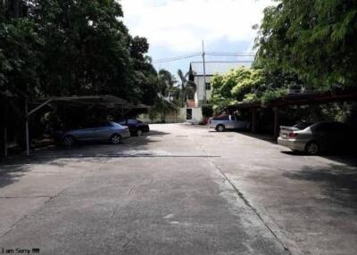 Outdoor parking lot with several cars