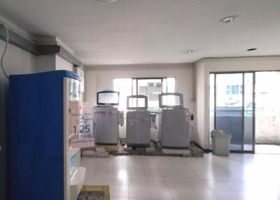 Laundry room with vending machines and multiple washers