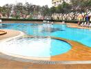 Swimming pool area with poolside seating