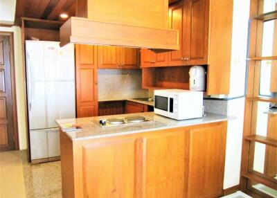 Modern kitchen with wooden cabinets and granite countertops