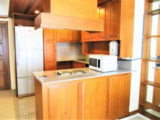 Modern kitchen with wooden cabinets and granite countertops