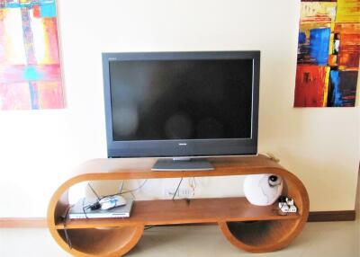 Living room with TV and modern wooden console