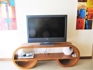 Living room with TV and modern wooden console