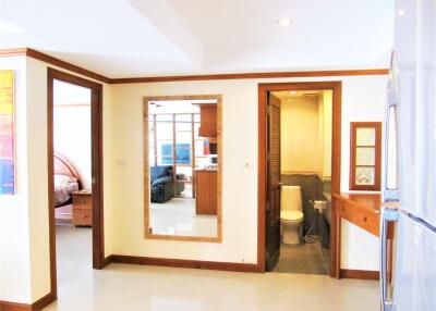 View of hallway with a glimpse of bedroom and bathroom