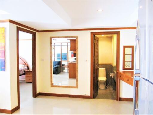 View of hallway with a glimpse of bedroom and bathroom