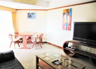 Living room with dining area and television