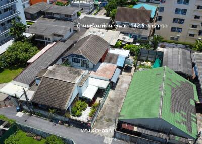 Aerial view of residential buildings with surrounding greenery