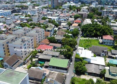 Aerial view of a residential neighborhood with various buildings and houses