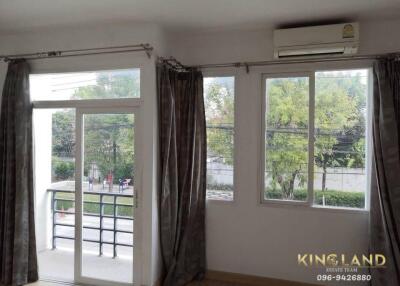 Living room with large windows and balcony access