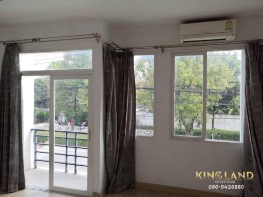 Living room with large windows and balcony access