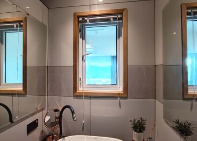 Modern bathroom with mirror and window