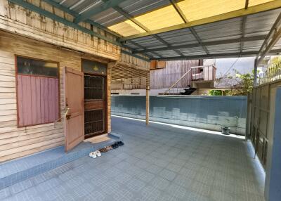 Spacious covered patio area with open door