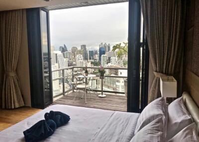 Modern bedroom with city view and balcony