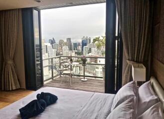 Modern bedroom with city view and balcony