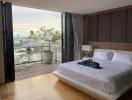 Modern bedroom with a view of the city and balcony