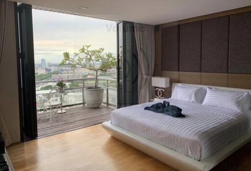 Modern bedroom with a view of the city and balcony