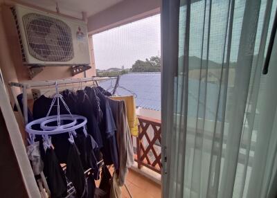 Balcony with air conditioning unit and clothes drying area