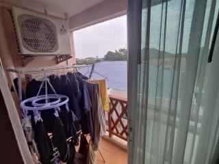 Balcony with air conditioning unit and clothes drying area