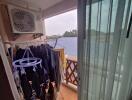 Balcony with air conditioning unit and clothes drying area