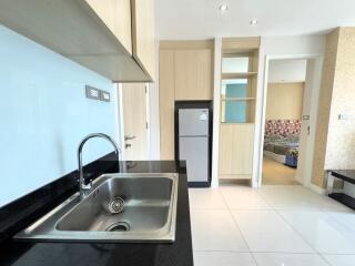 Modern kitchen with stainless steel sink and built-in appliances