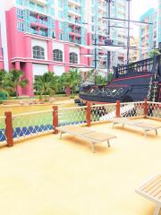 Outdoor recreational area with ship structure and lounge chairs