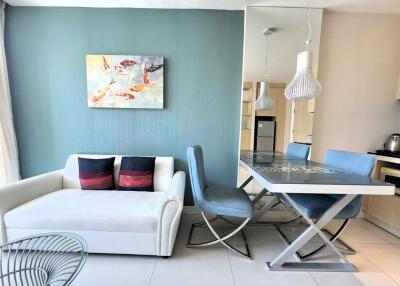 Modern living and dining area with blue accents