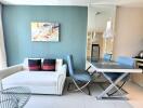 Modern living and dining area with blue accents