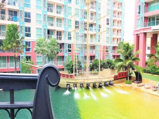 Colorful waterfront apartment building with unique pirate ship pool