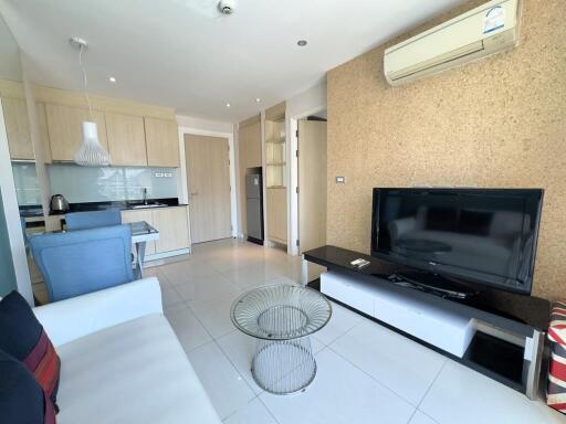 Modern living room with kitchen area and air conditioning